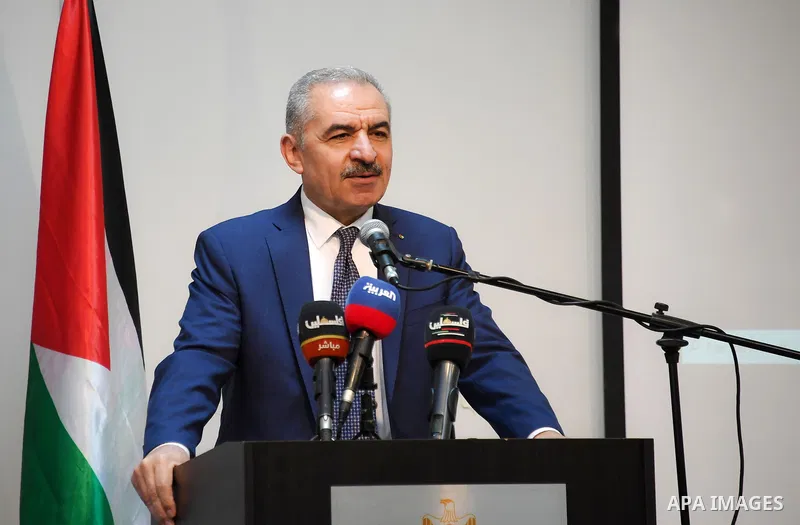 Palestinian Prime Minister Mohammed Ishtayeh, honors the representative of the World Health Organization office in Palestine, Dr. Gerald Rockenshoop, during a farewell party held for him to mark the end of his official d...