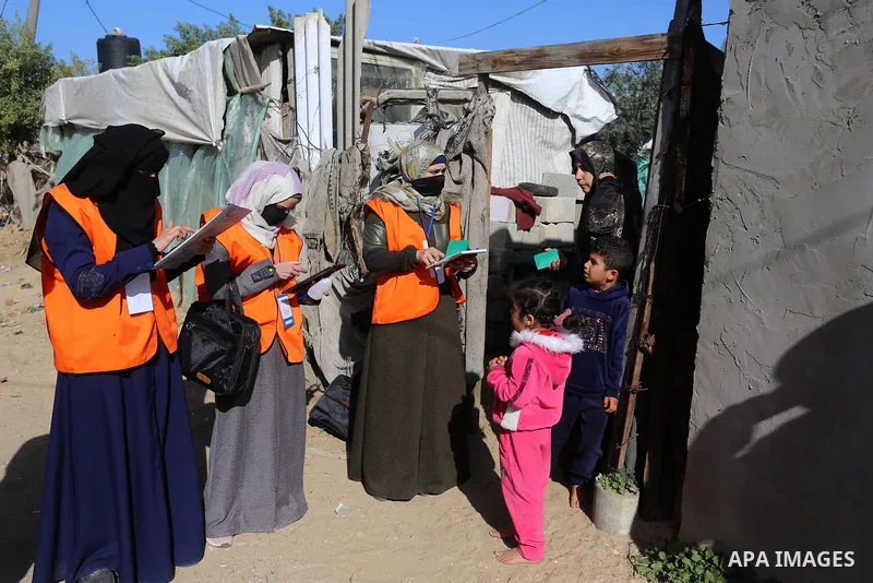 Palestinian members of Central Elections Commission register voters for the upcoming elections, at Nahr al-Bared refugee camp in Khan Younis in the southern Gaza Strip on February 11, 2021. Nahr Al-Bared is a marginalize...