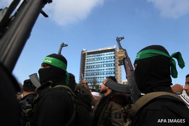 Palestinian militants from the Ezzedine al-Qassam Brigades, the armed wing of the Hamas movement attend the funeral of the leader Ibrahim Al-Yazuri,80, who died of the coronavirus (COVID-19) pandemicin, Gaza City on Febr...