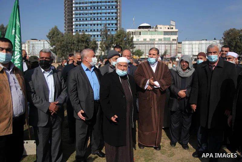members of the Palestinian Islamist Hamas movement take part in a funeral of the leader Ibrahim Al-Yazuri,80, who died of the coronavirus (COVID-19) pandemicin, Gaza City on February 12, 2021. Al-Yazuri is one of the fou...