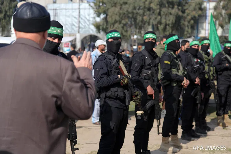 Palestinian militants from the Ezzedine al-Qassam Brigades, the armed wing of the Hamas movement attend the funeral of the leader Ibrahim Al-Yazuri,80, who died of the coronavirus (COVID-19) pandemicin, Gaza City on Febr...