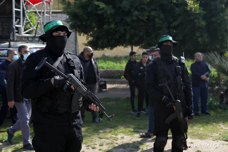 Palestinian militants from the Ezzedine al-Qassam Brigades, the armed wing of the Hamas movement attend the funeral of the leader Ibrahim Al-Yazuri,80, who died of the coronavirus (COVID-19) pandemicin, Gaza City on Febr...