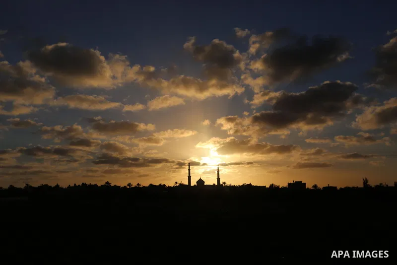 A general view show the sunset in Khan Younis in the southern of Gaza strip, on February 13, 2021. Palestine is going to be Sunny with a maximum temperature of 20°c and minimum temperature of 11°c. Expected precipitation...