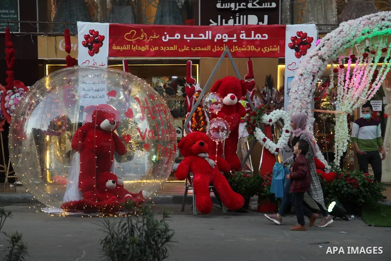 Palestinian vendors display flowers, red teddy bears, and pillows on Valentine's day, in Gaza city on February 13, 2021. Valentine's Day is increasingly popular in the region as people have taken up the custom of giving...