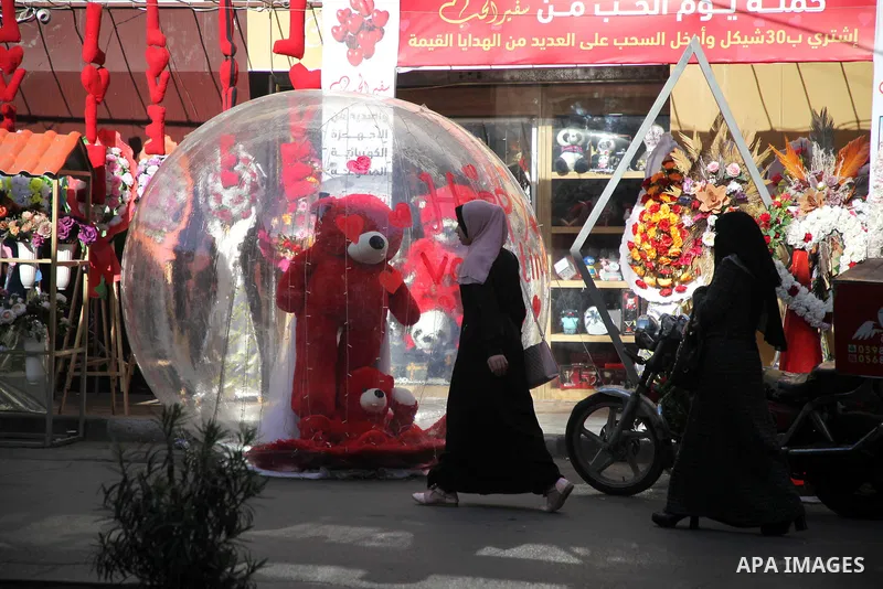 Palestinian vendors display flowers, red teddy bears, and pillows on Valentine's day, in Gaza city on February 14, 2021. Valentine's Day is increasingly popular in the region as people have taken up the custom of giving...
