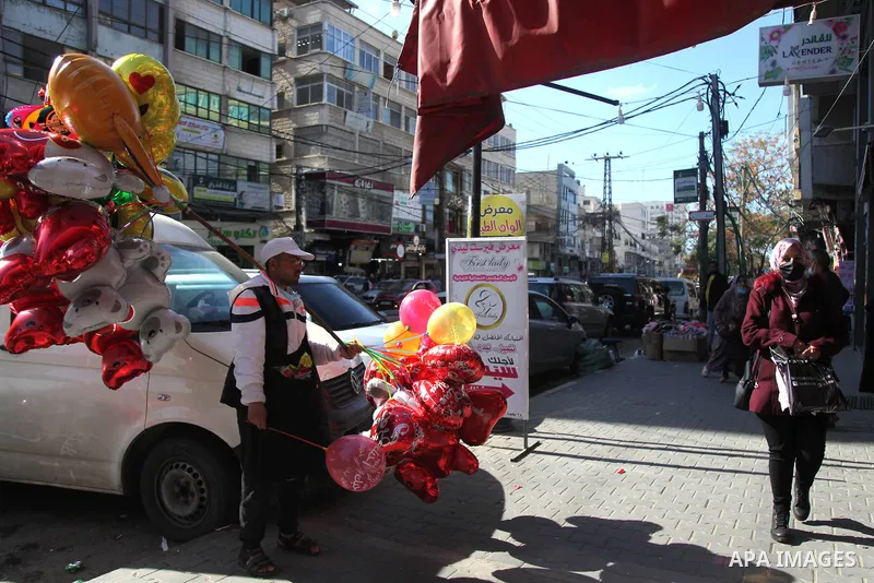 Palestinian vendors display flowers, red teddy bears, and pillows on Valentine's day, in Gaza city on February 14, 2021. Valentine's Day is increasingly popular in the region as people have taken up the custom of giving...
