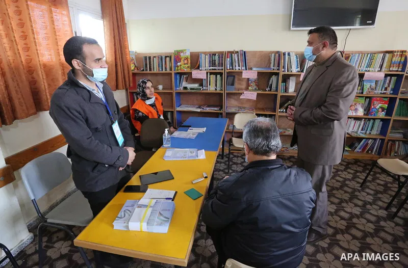 Diab al-Jrou, mayor of Deir al-Balah, inspects registration center at a school, in Deir Al-Balah, central Gaza Strip on February 16, 2021. The Palestinian Central Elections Commission (PCEC) announced on Wednesday that 2...