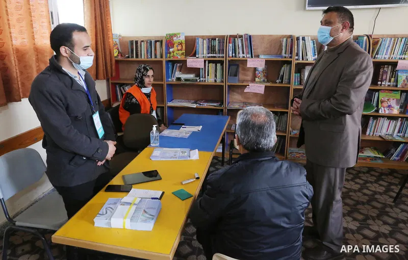 Diab al-Jrou, mayor of Deir al-Balah, inspects registration center at a school, in Deir Al-Balah, central Gaza Strip on February 16, 2021. The Palestinian Central Elections Commission (PCEC) announced on Wednesday that 2...