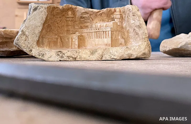 Palestinian artist Alaa Abu Heikal, carves Palestinian cultural and historical symbols on pottery, in the West Bank City of Hebron on February 17, 2021. The Culture of Palestine is the culture of the Palestinian people,...