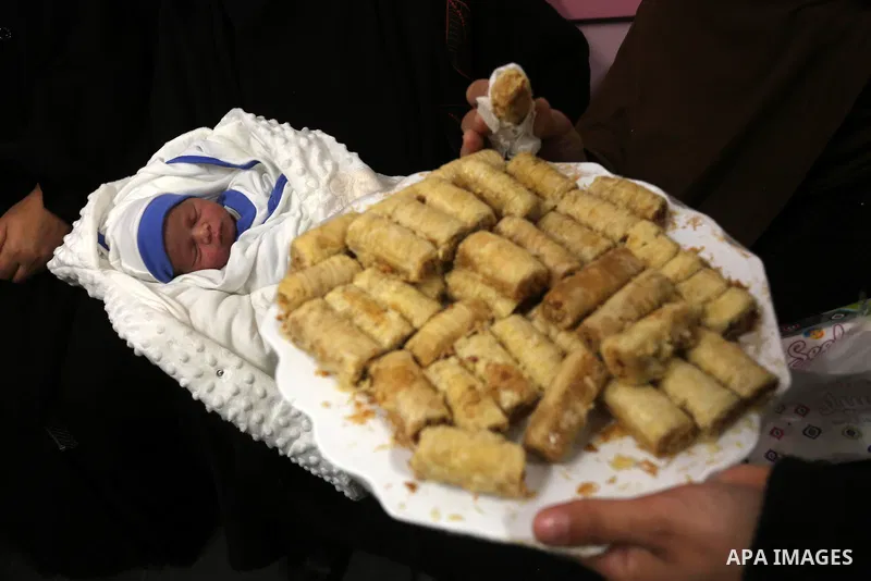 Relatives of Palestinian prisoner Muhammad al-Qudra celebrate, at Nasser Medical Complex in khan Younis in the southern of Gaza strip on February 18, 2021. Eman al-Qudra gave birth to her newborn in a successful smugglin...