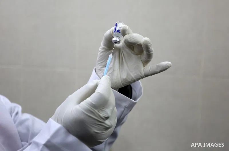A Palestinian health worker prepares a shot of the Russian Sputnik V coronavirus vaccine at European Hospital, in Khan Yunis, in the southern Gaza Strip on February 23, 2021. Around 20,000 coronavirus vaccine doses from...