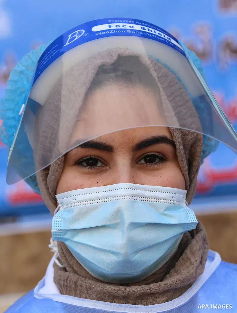 A Palestinian health worker poses a photo at a UN clinic in Gaza City, on February 24, 2021. Palestinians in Gaza began a limited COVID-19 vaccination programme on Monday after receiving doses donated by Russia and the U...