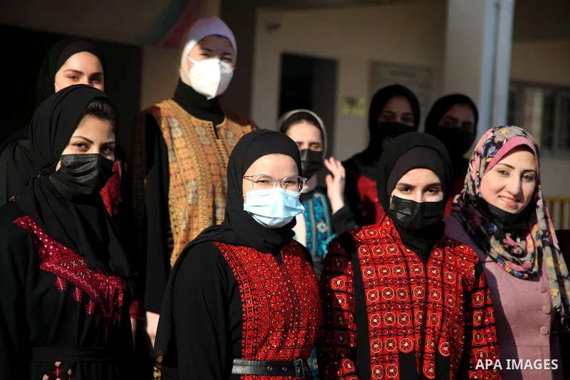 Palestinian students wearing protective face masks, return back to their school, in the morning of the first day of the second semester study, amid the coronavirus disease (COVID-19) outbreak, in Gaza city, on February 2...