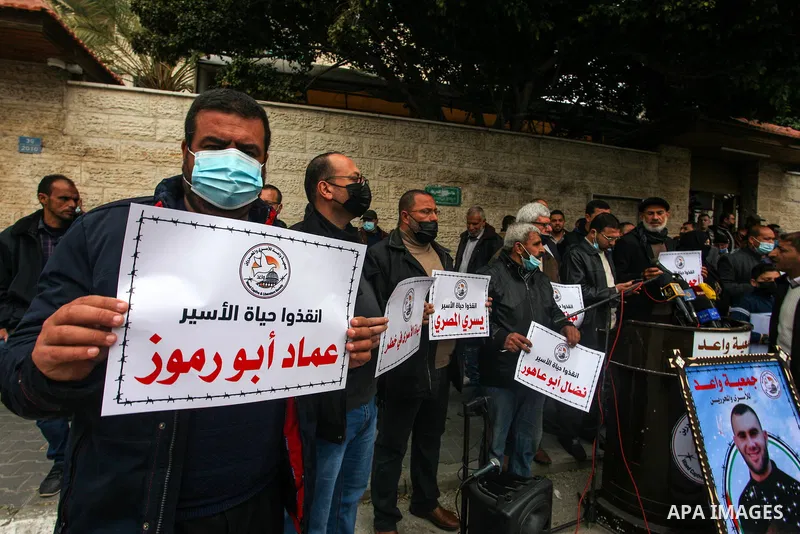 Palestinians take part in a protest to show solidarity with prisoner in Israeli jails, Ahmed Obeid, who suffers from cancer, in front of the headquarters of Red cross in Gaza city, on March 01, 2021. The Detainees and Ex...