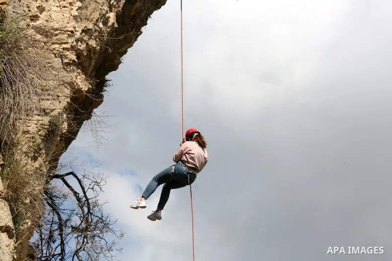 Team Rahal Palestine climb slopes on Wadi al-Qaf west of Hebron, on March 5, 2021. Wadi al-Qaf is a protected area of 4,600 dunums of the state’s land. The cultivated area is about 2,800 dunums, according to the estimate...