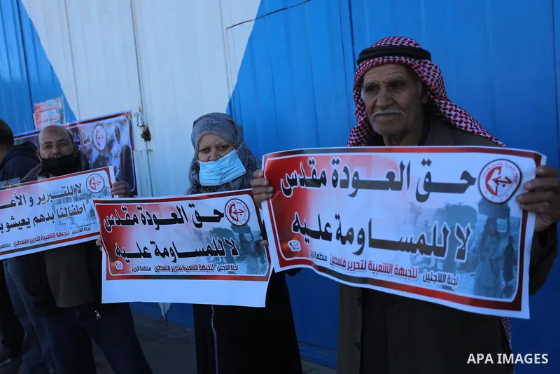 Palestinian refugees take part in a protest against the reduction of the food basket provided by UNRWA, in front of the its headquarter, in Al-Bureij camp in the central Gaza Strip, on March 6, 2021. Closure of the aid d...