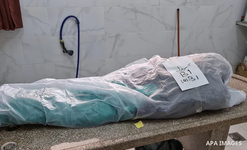 The body of Palestinian fisherman was killed in an explosion of unknown cause off the coast of the Gaza Strip, is seen Al-Nasser Hospital morgue, in Khan Yunis, southern Gaza Strip, on March 7, 2021. Photo by Ashraf Amra