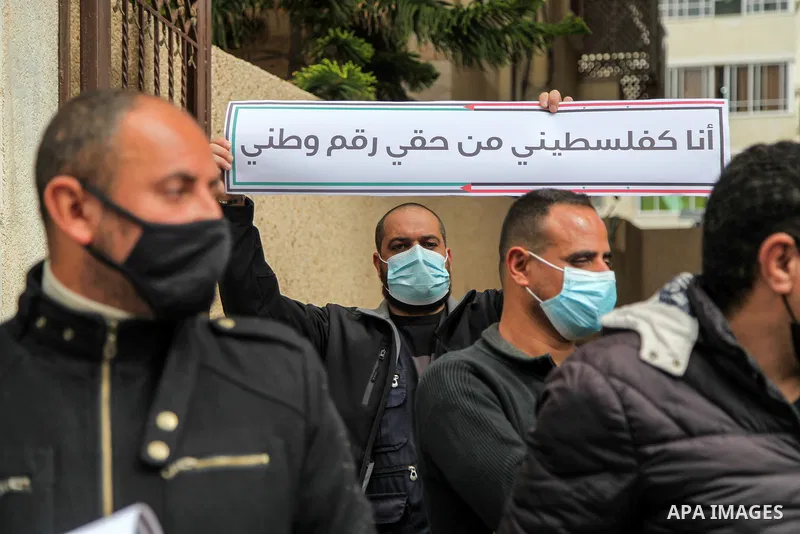 Refugees from Palestine Syria Libya and Yemen, take part in a protest to demand their rights and provide job opportunities, in Gaza city, on March 7, 2021. Nearly one-third of the registered Palestine refugees, more than...