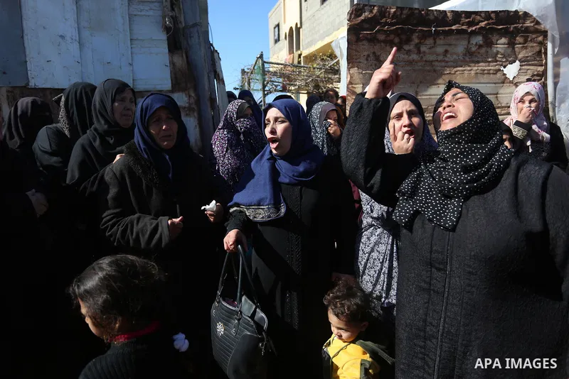 Relatives of the three Palestinian fishermen, who were killed when their boat exploded off Gaza's coast in the Mediterranean Sea, mourn during their funeral in Khan Yunis in the southern Gaza Strip on March 7, 2021. Thre...