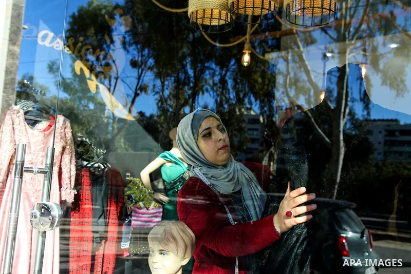 A Palestinian tailor Amina Hamo, 28, sews at her workshop on the International Women's Day, in Gaza city on March 8, 2021. In light of difficult economic and living conditions for Gazans. Throughout the decades that Pale...