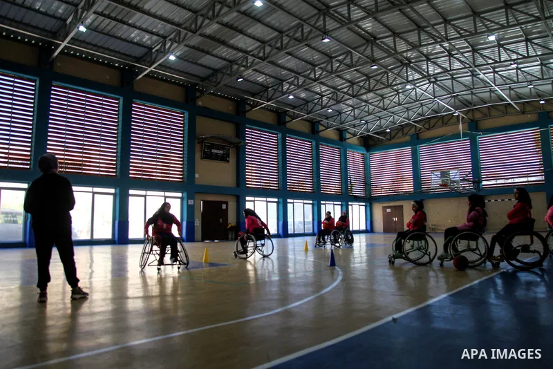 Palestinians women of special needs take part in a basketball training in a gymnasium, on the International Women's Day, on March 8, 2021. International Women's Day (IWD) is celebrated on 8 March around the world. It is...