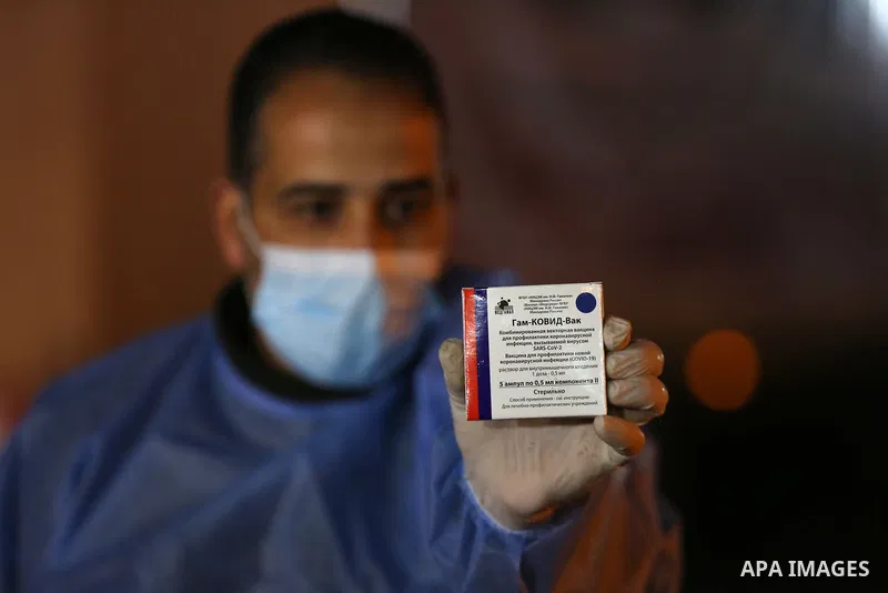 A Palestinian health worker shows a box of Russia's Sputnik V vaccine sent by United Arab Emirates, amid the coronavirus disease (COVID-19) outbreak, at Rafah crossing in the southern Gaza Strip on March 11, 2021. The va...