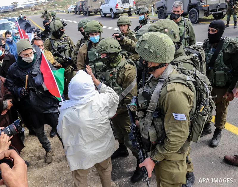 Palestinians and Israeli activists trying to block Route 60, the main Jewish settler road in the West Bank, as a protest against the confiscation of Palestinian land are dispersed by Israeli security forces near the vill...