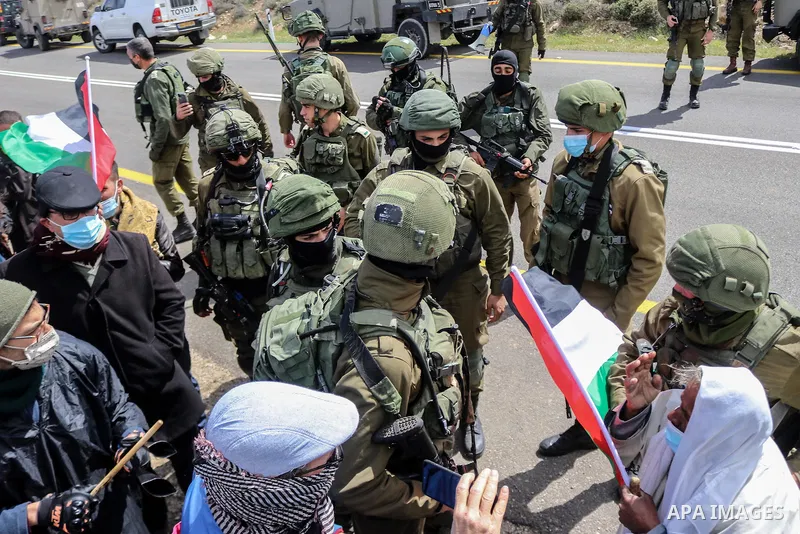 Palestinians and Israeli activists trying to block Route 60, the main Jewish settler road in the West Bank, as a protest against the confiscation of Palestinian land are dispersed by Israeli security forces near the vill...