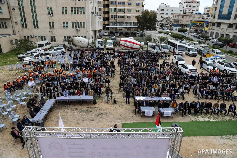 Representatives of Palestinian industries, workers, and the private sector in the Gaza Strip, take part in a protest in Gaza City on March 13, 2021. Representatives of Palestinian industries, workers, and the private sec...