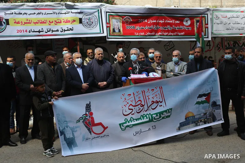 The General Secretary of the Palestinian National Initiative party Mustafa Barghouti, takes part in a portest on the Palestinian Wounded's Day, in Gaza city, on March 13, 2021. Al-Mezan Center for Human Rights said that...