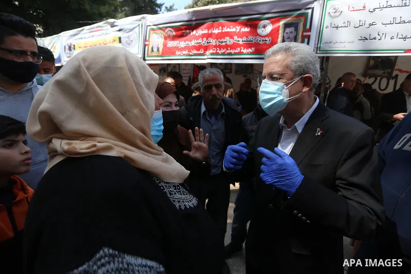 The General Secretary of the Palestinian National Initiative party Mustafa Barghouti, takes part in a portest on the Palestinian Wounded's Day, in Gaza city, on March 13, 2021. Al-Mezan Center for Human Rights said that...