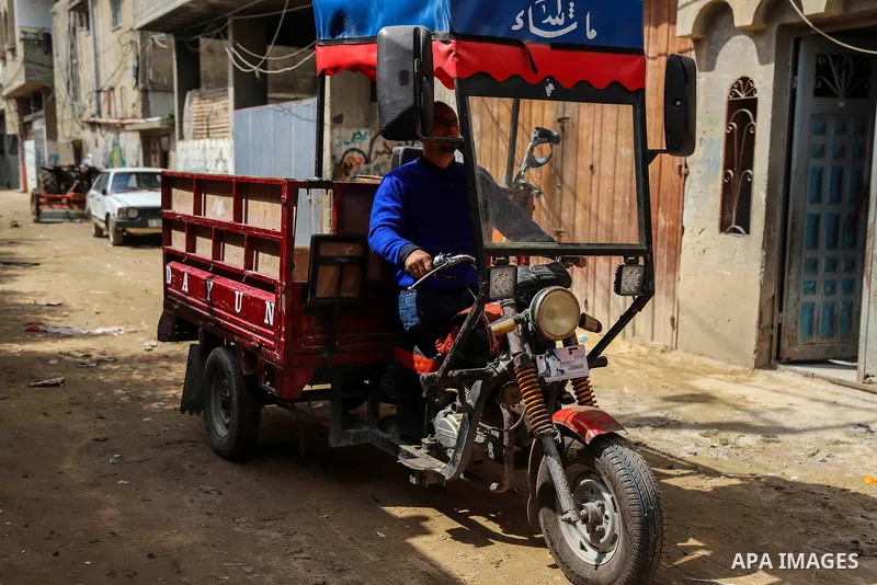 Palestinian Mohammed Totah with amputated leg, works to transport goods to shops, on the Palestinian Wounded's Day, in Gaza city, on March 13, 2021. Totah, 33 year-old, who had lost his leg and left eye, during the Israe...