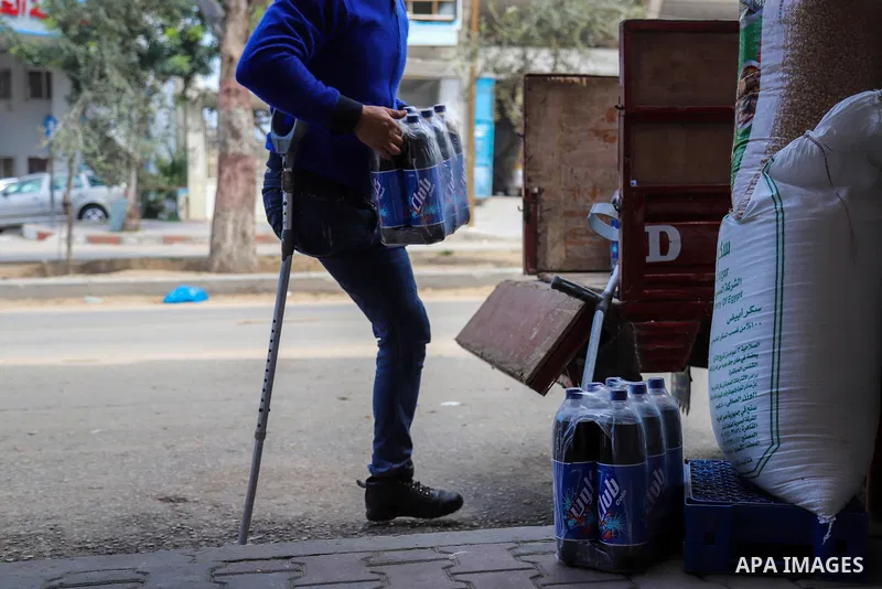 Palestinian Mohammed Totah with amputated leg, works to transport goods to shops, on the Palestinian Wounded's Day, in Gaza city, on March 13, 2021. Totah, 33 year-old, who had lost his leg and left eye, during the Israe...