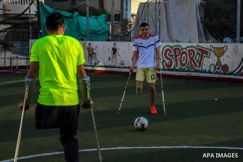 Disabled Palestinians who lost their legs by Israeli troops take part in the Football training on the Palestinian Wounded's Day, in Gaza city, on March 13, 2021. Al-Mezan Center for Human Rights said that more than (250,...
