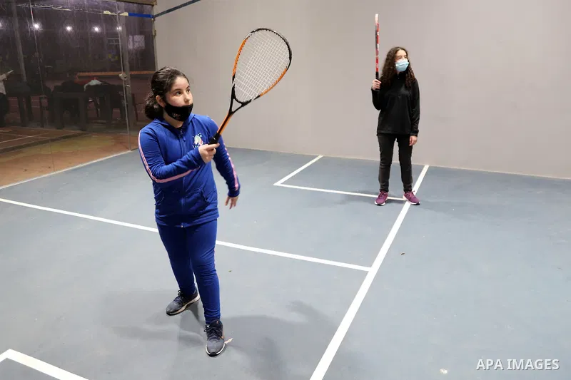 Palestinian children play squash, at Champions Academy, in Gaza city on March 15, 2021.The only squash academy in the Gaza Strip. Squash has its origins in the older game of rackets which was played in London's prisons i...
