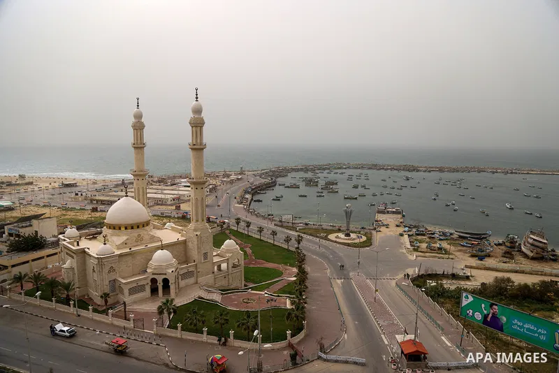 A general view shows the sea port during a sand wind (khamsin), of Gaza City on March 23, 2021. Khamsin, chamsin or more commonly known in Egypt as khamaseen is a dry, hot, sandy local wind affecting Egypt and the Levant...
