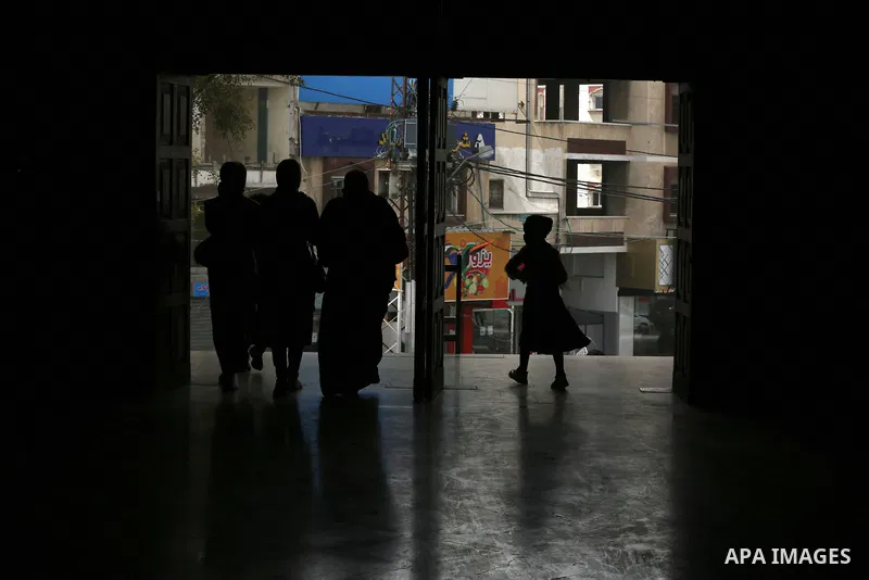 Palestinians wear protective face masks, amid the coronavirus disease (COVID-19), attend the operetta entitled "Gharib ya Bladi" on the anniversary of the Battle of Dignity and International Theater Day in Gaza City on M...