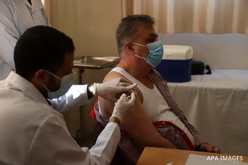 Palestinians receive the dose of the coronavirus disease (COVID-19) vaccine at the UNRWA clininc, in Gaza city on March 25, 2021. The Palestinian authorities have begun administering vaccines supplied under the internati...
