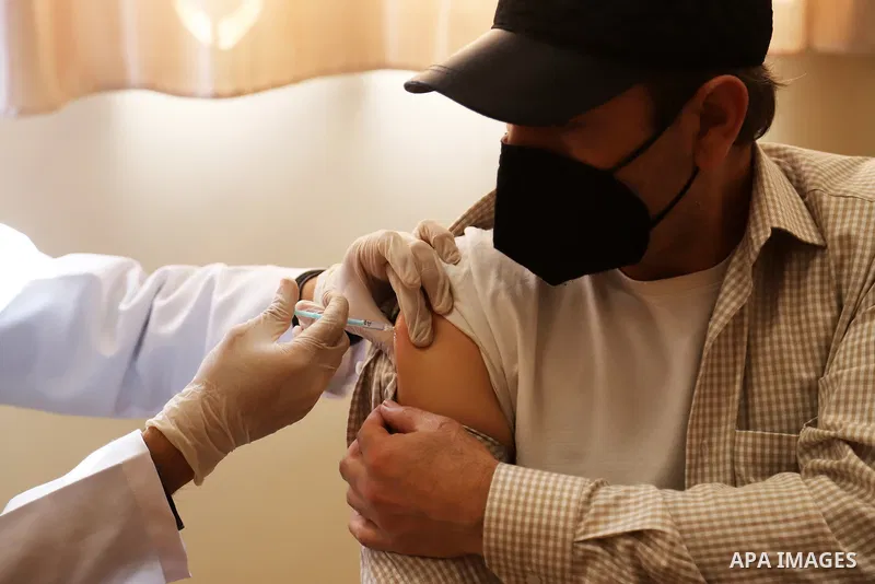 Palestinians receive the dose of the coronavirus disease (COVID-19) vaccine at the UNRWA clininc, in Gaza city on March 25, 2021. The Palestinian authorities have begun administering vaccines supplied under the internati...