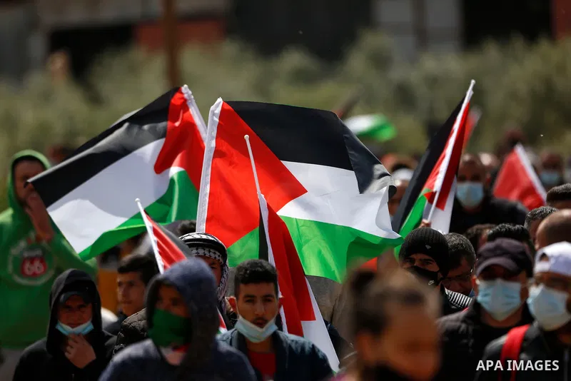 Palestinian demonstrators confront Israeli security forces during a protest against the establishment of Israeli outposts in Palestinian lands, in Beit Dajan in the Israeli-occupied West Bank March 26, 2021. Israeli forc...