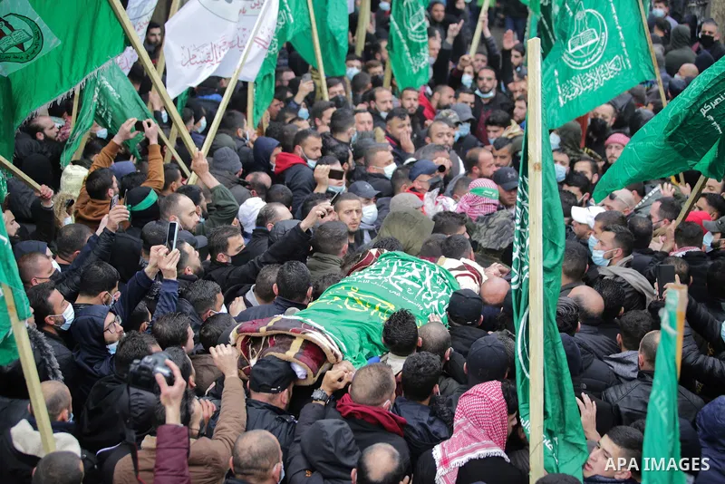 Palestinians attend the funeral of a founding committee member of the Palestinian Campaign for the Academic and Cultural Boycott of Israel (PACBI) and a co-founder of the Boycott, Divestment and Sanctions (BDS) movement,...