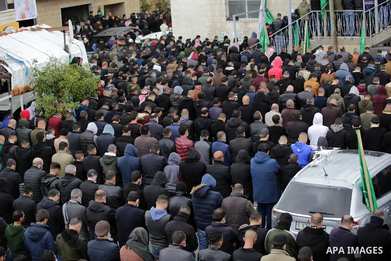 Palestinians attend the funeral of a founding committee member of the Palestinian Campaign for the Academic and Cultural Boycott of Israel (PACBI) and a co-founder of the Boycott, Divestment and Sanctions (BDS) movement,...