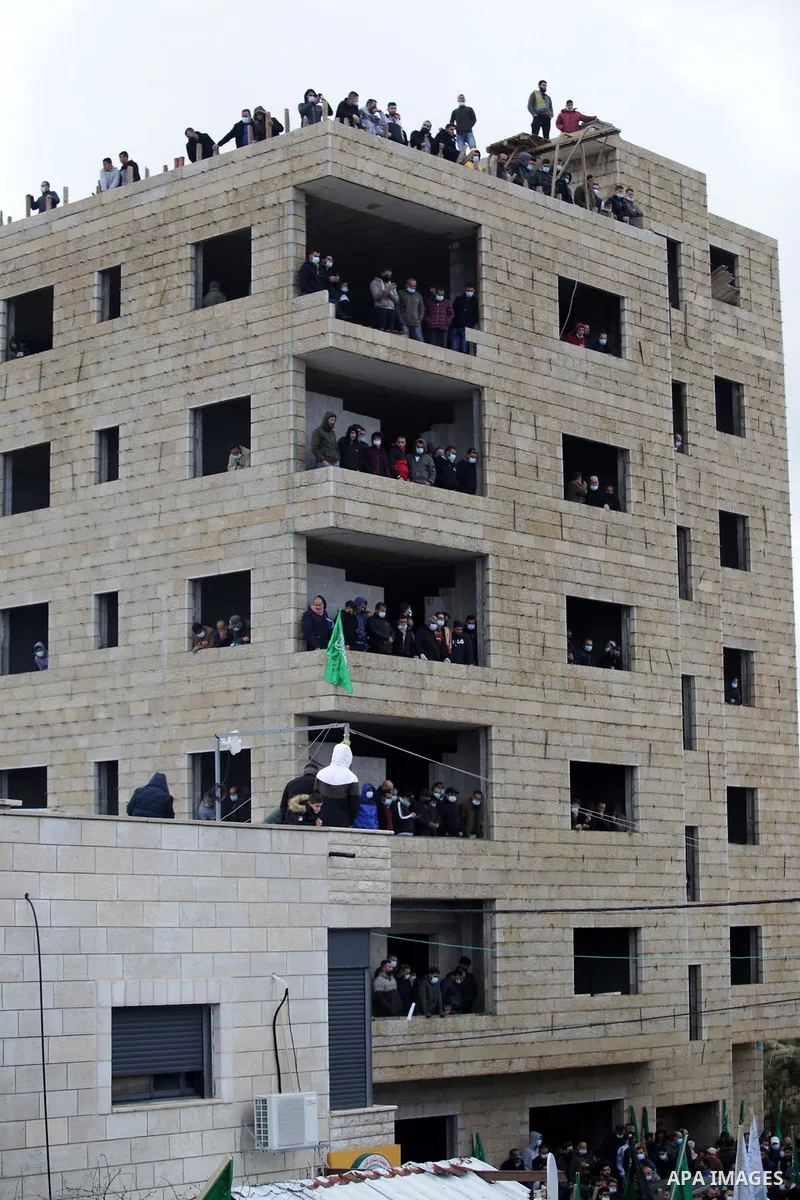 Palestinians attend the funeral of a founding committee member of the Palestinian Campaign for the Academic and Cultural Boycott of Israel (PACBI) and a co-founder of the Boycott, Divestment and Sanctions (BDS) movement,...