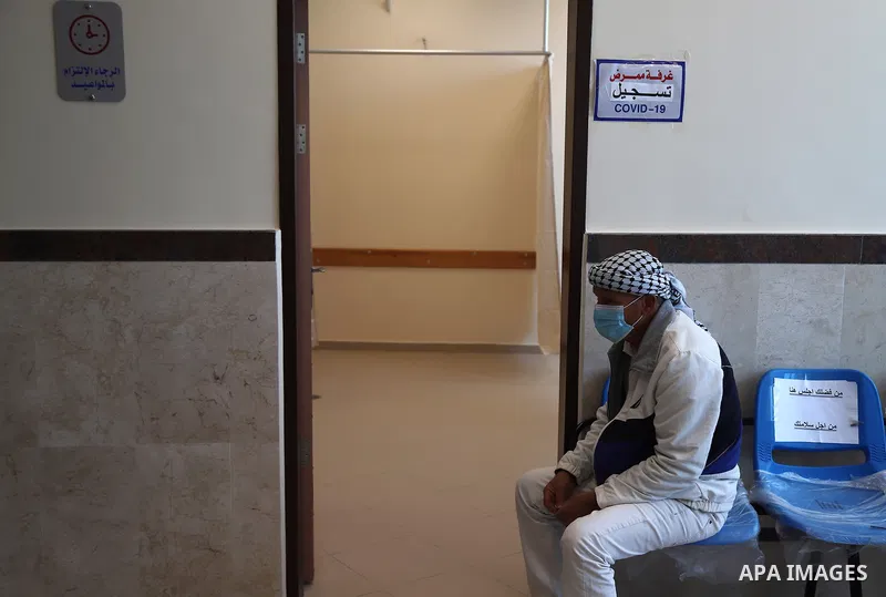Palestinians receive the dose of the coronavirus disease (COVID-19) vaccine at the UNRWA clininc, in Gaza city on March 27, 2021. The Palestinian authorities have begun administering vaccines supplied under the internati...