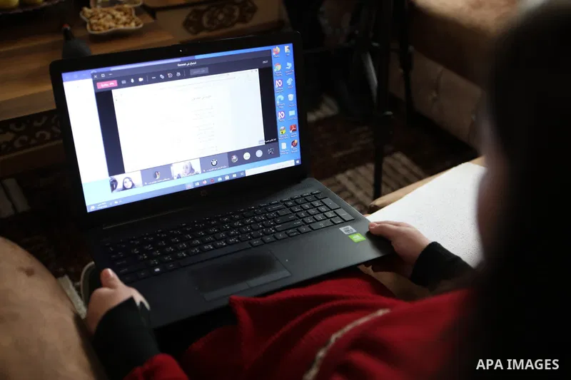 The two blind Palestinian children, Yusef and Retaj Abu Dawood, receive electronic education in Braille, at their home in the West Bank City of Hebron on March 28, 2021. The COVID-19 crisis continues to rattle K-12 educa...