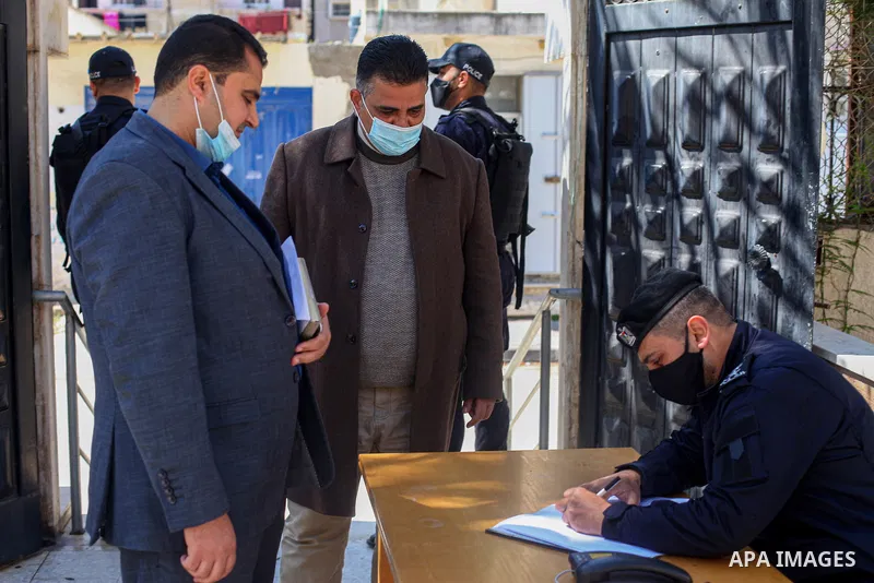 One of the candidates for Palestinian MP Hassan Khreisheh, (Deputy Speaker/Independent) in Gaza strip, Anwar Al-Shaer, registers party lists for parliamentary election, at the Central Elections Commission's office in Gaz...