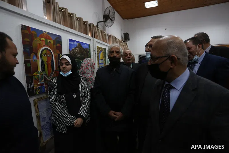 Palestinians attend the first international exhibition in Palestine for plastic art entitled (Palestine is a land and a people), inside the YMCA in Gaza City on March 29, 2021. Contemporary Palestinian art finds its root...