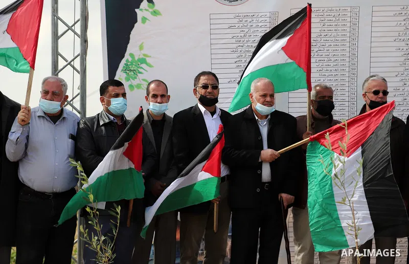 Palestinian members of the National commission for the great return march and break siege against Century Deal, attend a press confernce, near the border with Israel, east of Gaza City on March 30, 2021. Palestinians eve...