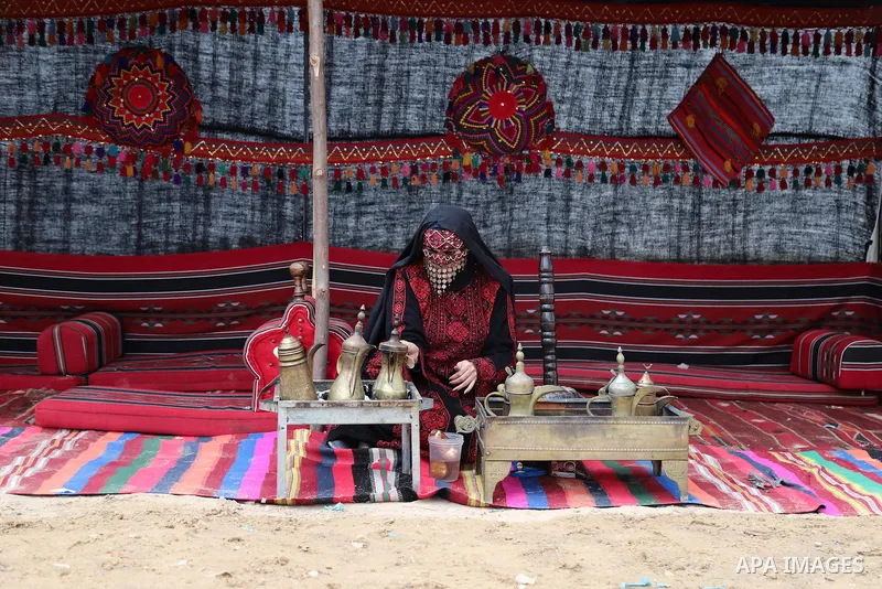 Palestinians attend the opening of the "Rabie My Country" bazaar for saplings and flowers on the 45th anniversary of Land Day, in Gaza City on March 30, 2021. Palestinians every year mark Land Day on March 30 commemorati...