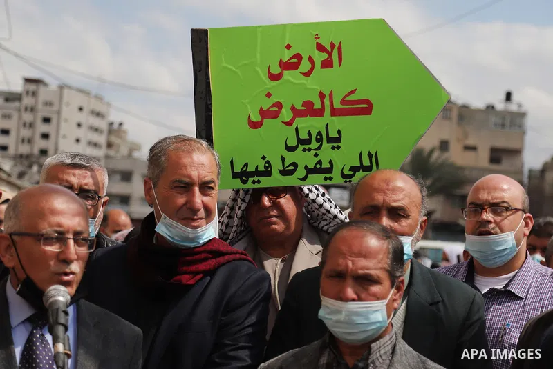 Palestinians attend the opening of the "Rabie My Country" bazaar for saplings and flowers on the 45th anniversary of Land Day, in Gaza City on March 30, 2021. Palestinians every year mark Land Day on March 30 commemorati...